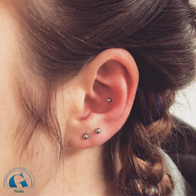 graphicaderme-vaucluse-piercing-orange-nadia-conch-lobe